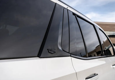 tinted windows on a chrome delete Cadillac Escalade suv.